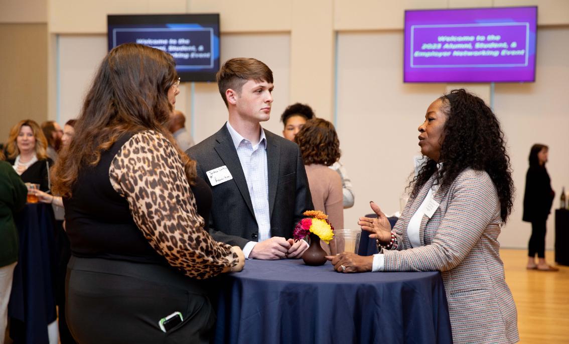 Alum networking with students during Career Week