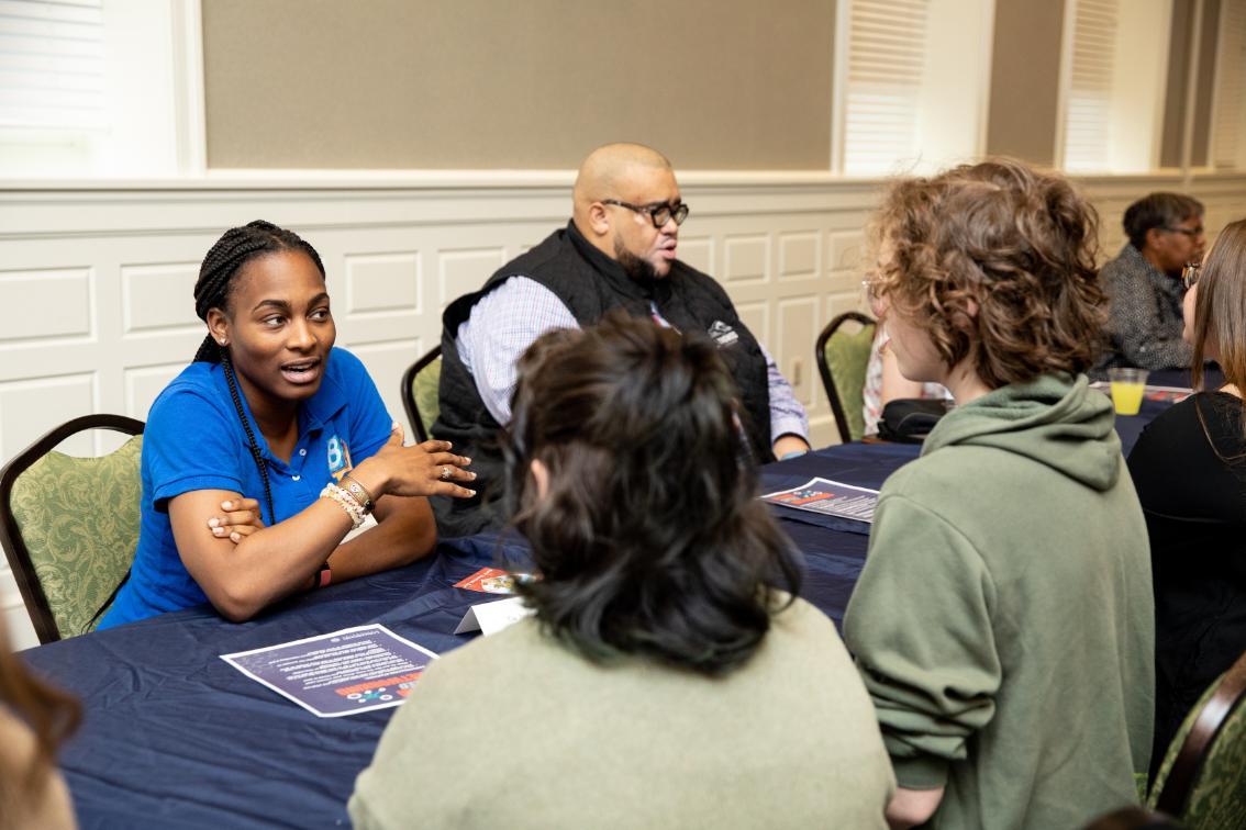 Alum advising students during speed networking