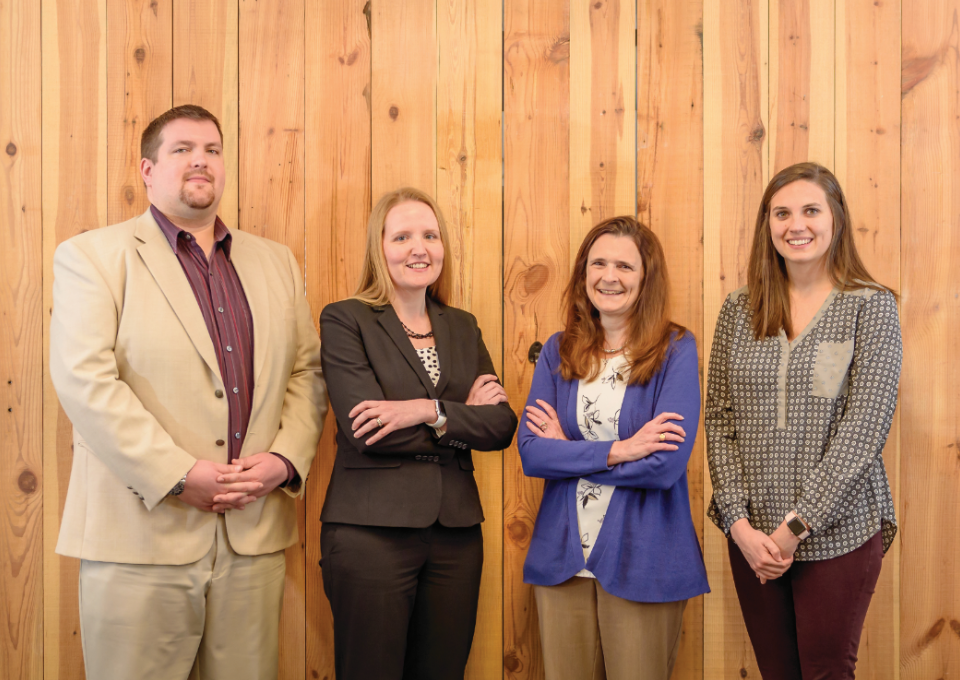 Nicholas Kinsler ’08 (left),Tonya Futrell ’02, RebeccaTres ’93 and Shelby Robertson ’13 are among five Longwood graduates working at Wells Coleman, a Richmond-based accounting, tax and financial consulting firm. Photo credit: Ted Hodges