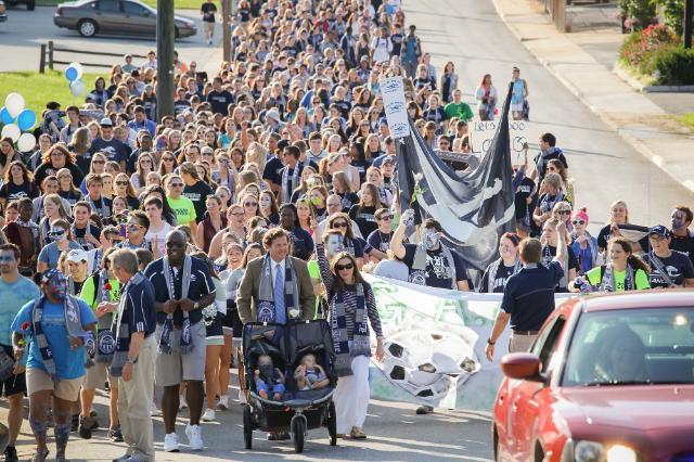 The Longwood community marching up to the Athletics Complex as part of The G.A.M.E.