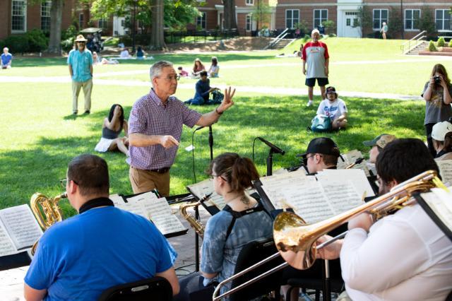 Dr. Charlie Kinzer conducts the Jazz Ensemble performing on campus