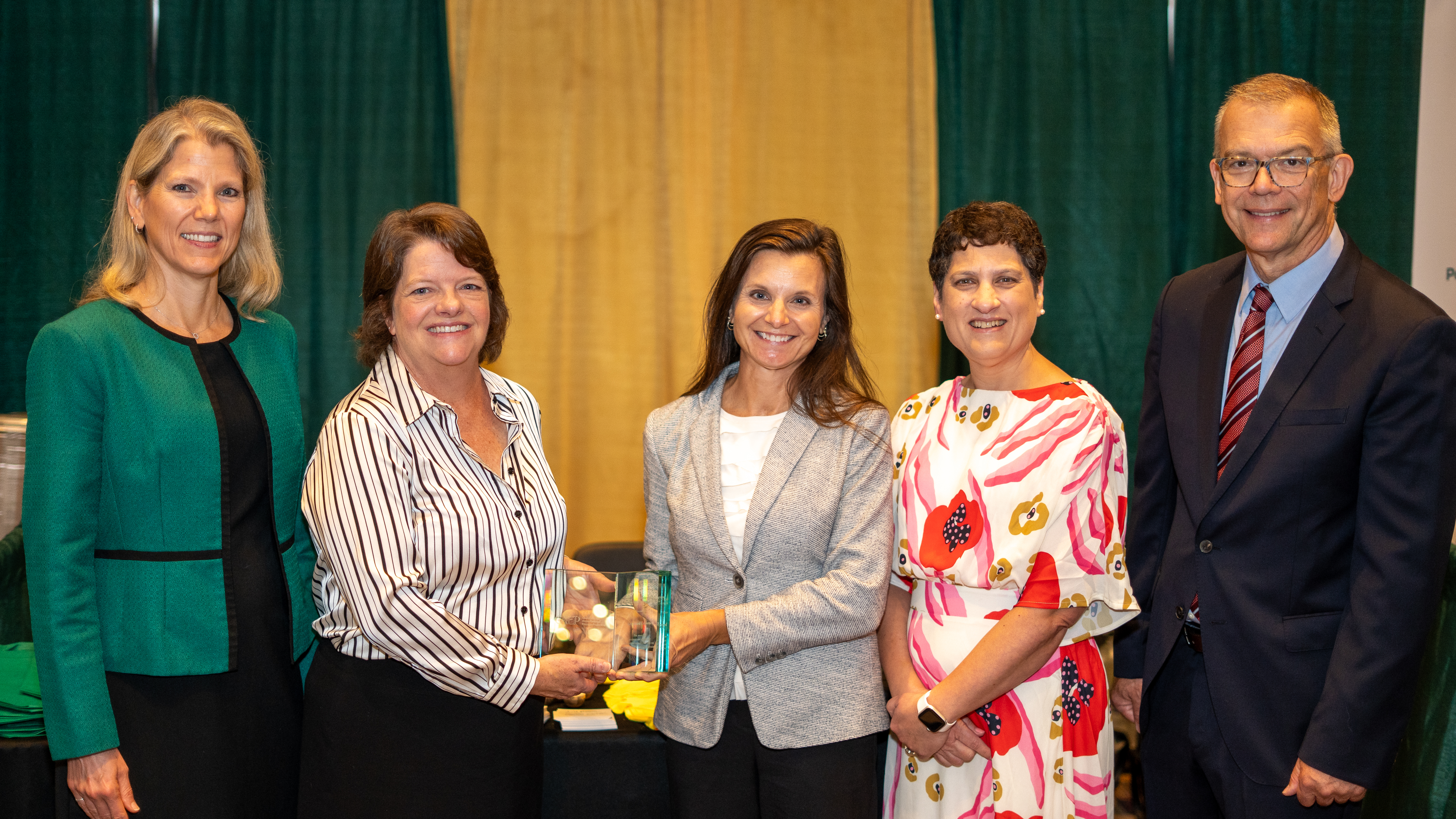 Professor of School Librarianship Dr. Karla Collins (second from left) and Office of Teacher Preparation Director Dr. Tara McDaniel (third from left) recently accepted the Frank Murray Award on behalf of Longwood from CAEP officials.